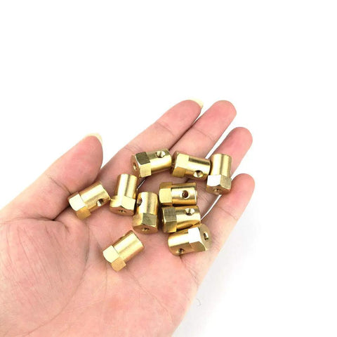 10 Pack 7mm Flexible Motor Couplers For DC Motors And Car Shafts Pro Grade Brass Linkage Connectors With M4 Screws And 4mm Allen Wrenches Great For Wheels Tires And Motor DIY Projects brass 7mm couplers in hand