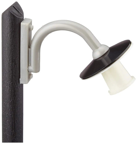 Silver and black wall-mounted outdoor light fixture on wooden post