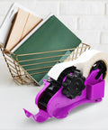 Heavy Duty Semi Automatic Packing Tape Dispenser Smooth Operator Design With Nifty Dual Cutting Station beside a wire basket with notebooks.