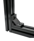 Eight Piece Set Of Tough As Nails Black Corner Brackets Built For 4040 And 4080 Aluminum Extrusion Profiles Featuring Slick Anodized Finish And Complete M8 Hardware Bundle, close-up view of black bracket on aluminum frame.