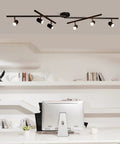 Sleek matte black 6-light foldable LED track lighting with center swivel heads on a modern office ceiling setup.