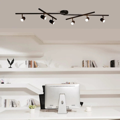Sleek matte black 6-light foldable LED track lighting with center swivel heads on a modern office ceiling setup.