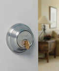 SmartKey Security Exterior Deadbolt With Keyed Entry In Satin Nickel Model 980 Quick Rekey In Seconds on door in living room view.