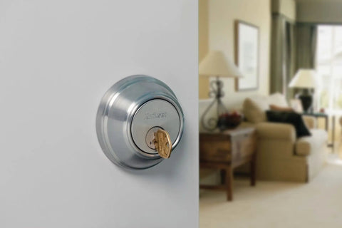 SmartKey Security Exterior Deadbolt With Keyed Entry In Satin Nickel Model 980 Quick Rekey In Seconds on door in living room view.