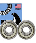 Shielded Ball Bearing 12x32x10mm Chrome Steel 6201 ZZ, Two Pack, Ultra Durable And High RPM Support For Smooth Low-Friction Performance In Machinery, Hobby Projects, And Upgrades. Two shielded chrome steel bearings in front of box.