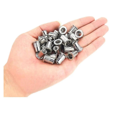 Stainless Steel Flat Head Rivet Nuts for Home DIY And Metal Work Projects Featuring Knurled Bodies in a hand, showcasing multiple fasteners.