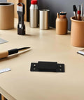 Heavy Duty Adjustable Invisible Door Hinges Black 5-Inch Square Concealed Cabinet Secret Door Hardware on desk