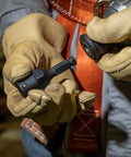Worker handling NRHDA Hex Quick-Change Socket Adapter For NRHD, 7/16-Inch, Rust-Resistant Black Finish in gloved hands