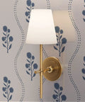 Kick Up Walls With Cottage Floral Blue And Silver Metallic Wallpaper featuring a wall lamp highlighting the floral design.