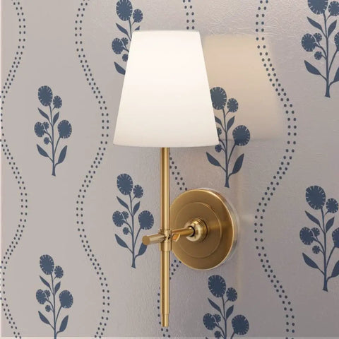 Kick Up Walls With Cottage Floral Blue And Silver Metallic Wallpaper featuring a wall lamp highlighting the floral design.