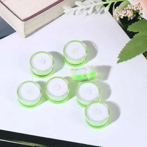 10 Pack Circular Bubble Spirit Levels Acrylic Round Bubble Level Set on white surface with green fluid for calibration