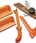Dead Nuts Safe Five Piece Shop Safety Kit Featuring Dual Push Blocks A Notch Stick And Miter Gauge Featherboard in bright orange.