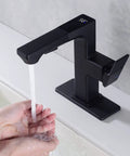 Person washing hands under LED Temperature Display Matte Black Bathroom Faucet With Pull Out Sprayer, Single Handle RV Vanity Faucet