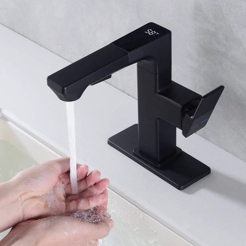Person washing hands under LED Temperature Display Matte Black Bathroom Faucet With Pull Out Sprayer, Single Handle RV Vanity Faucet