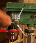 Three Piece M8 X 200 Millimeter Drill Press Handle Kit With Built Tough Phenolic Knobs And Ergonomic Crank for bench drill machine in use.