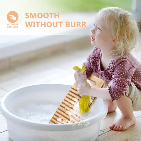 Child using No Sweat Bamboo Washboard For Hand Washing Clothes with grooves and yellow cloth in a sink.
