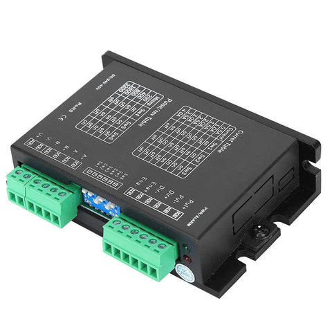 Black stepper motor driver module with two green terminal blocks and a printed wiring diagram on top.