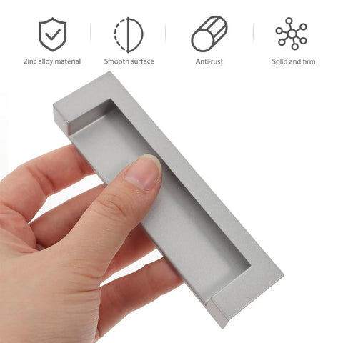 Hand holding 2-Piece Black Recessed Drawer Pull Handles Zinc Alloy Concealed Furniture Hardware For Cabinets, Wardrobes, And Sliding Doors Replacement