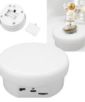 Electric Rotating Display Stand With 360 Smooth Spin Motorized Rotary Base supporting jewelry and small gadgets from top view.
