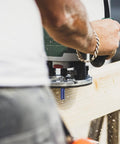 User operating a router with a Heavy Duty Double Flute Straight Router Bit Set With 1/4 Inch Shank Carbide Tips for detailed cuts.