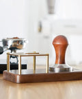 Boss Grade Wood And Copper Espresso Tamper Station Heavy Duty Coffee Tamping Stand with rubber base and 58mm portafilter holder.