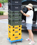 Person stacking Durable Plastic Tool Box With Comfortable Handle Stackable Organizer Multifunctional Storage Case near a car