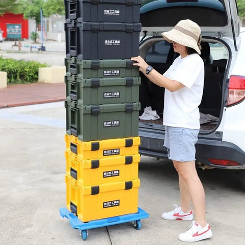 Person stacking Durable Plastic Tool Box With Comfortable Handle Stackable Organizer Multifunctional Storage Case near a car
