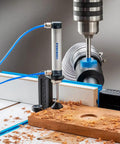 Close-up of Beefy Drill Press Table and Fence for Rock-Solid, Repeatable Drilling with wood shavings and drilling hole.