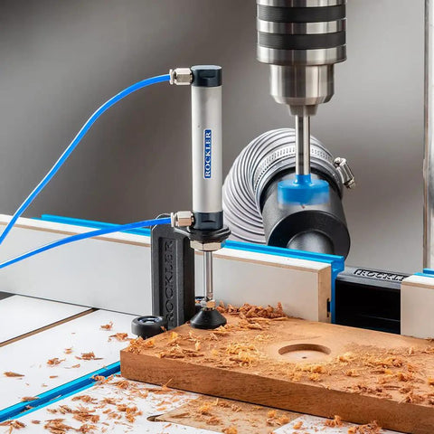 Close-up of Beefy Drill Press Table and Fence for Rock-Solid, Repeatable Drilling with wood shavings and drilling hole.