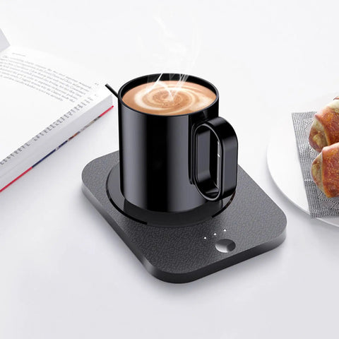 Keep Your Daily Java Piping Hot On Autopilot With This Electric Coffee Mug Warmer Featuring 3 Custom Heat Levels And A Roomy 43oz Ceramic Cup For Desk, black mug on warmer.