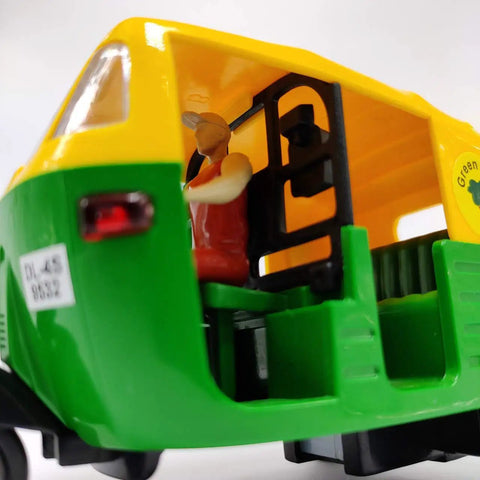 Ace Handcrafted Miniature Auto Rickshaw Desk Model Sporting vivid yellow and green finish showcasing detailed interior with driver figurine.