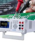 Rugged Desktop Digital Multimeter True RMS 55000 Counts for AC and DC current, voltage, and capacitance testing in use on circuit board