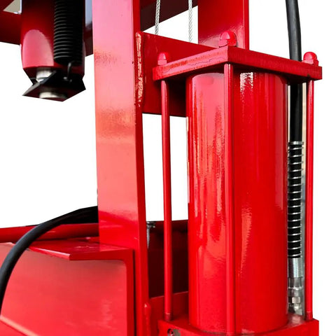 Close-up of red 50 Ton Hydraulic Shop Press With H Frame Workhorse Adjustable Working Table Height Twenty Seven And A Half Inch Bed.