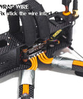 Heavy Duty Aluminum Foil Tape For HVAC Ducts securing orange wires on a black carbon fiber frame close-up.