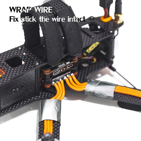 Heavy Duty Aluminum Foil Tape For HVAC Ducts securing orange wires on a black carbon fiber frame close-up.