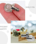 24 Pack Zinc Alloy Shelf Pegs and Pins for Wardrobe and Cabinet, heavy duty, close-up on finger, wood shelf support