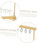 Conservation Of Energy Model Kit with crystal beads and wooden frame showcasing pendulum science for students.