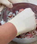 Top Notch Latex Disposable Gloves With Corn Starch Powdered Finish For Food Handling And Light Industrial Chores Smooth As Butter X Large mixing meat in a bowl.
