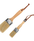 Two Piece Wood Handle Paint And Stain Brush Set With Oval Synthetic Bristles For Furniture Walls And Decks Staining And Painting Pro Grade Heavy Duty Home Improvement Tools, featuring large and small brushes with leather loops.