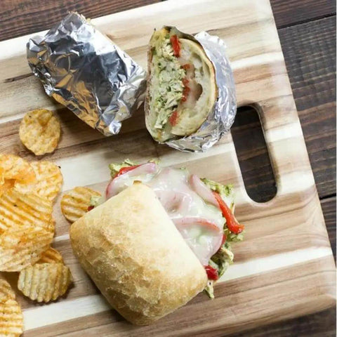 Pre Cut Pop Up Aluminum Foil Sheets 14 By 10.25 Inches Pack Of 50 For Quick No Mess Wrapping And Easy Lift with wrapped sandwich on board