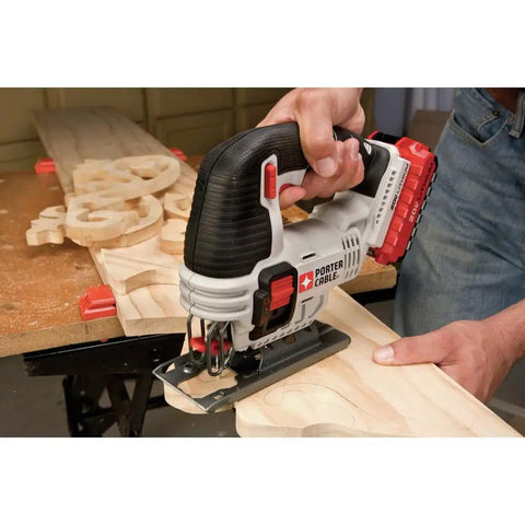 User operating Shop Tested 20V Max Cordless Jigsaw With Built In Dust Blower and Easy Swap Blade Clamp on wood.