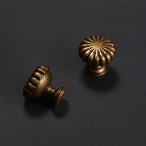 10 Pack Antique Brass Kitchen Cabinet Knobs Set With Retro Drawer Hardware Aged Bronze Zinc Alloy Handles showcased on dark surface
