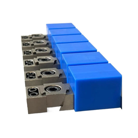 Close-up of Beefy CNC Clamp Vise for Multi-Station Pneumatic Milling, Single-Sided OK Clamp with blue protective covers.