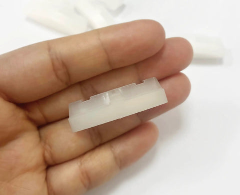Close-up of 4 Pieces Toilet Seat Bumpers Replacement Kit for Quiet Close Lids, rubber cushion detail, durable ABS material