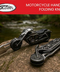 Motorcycle Style Folding Knife With 4.75 Inch Etched Stainless Blade Cast Metal Bike Handle on rock