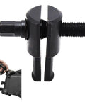 Close-up of Beefed Up Heavy Duty Motorcycle Steering Neck Bearing Race Remover Tool showing jaws and threaded handle.