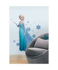 Disney Frozen Elsa Giant Peel And Stick Wall Decals Perfect For Kids Room Decor Super Easy To Apply Removable No Sticky Residue Huge Size 48.75 Inches Wide By 41.5 Inches High With 44 Pieces showing Elsa with snowflakes next to a grey chair on a smooth wall.