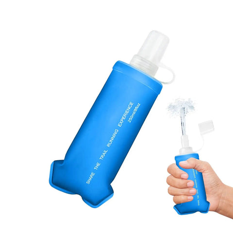 Foldable Water Bottle Soft Portable Leakproof Folding Pouch For Active Mobility Flexible Beverage Sac With Carabiner Made From High Grade Synthetic Film Hydration Gear Slim Pocket Bottle For Runners Hikers And Everyday On The Go, shown as a blue collapsible bottle being held.