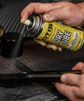 Dry Lube Aerosol 4 Oz Fast Acting Lubricant Spray For Metal Surfaces Dries In Seconds being used on metal tool