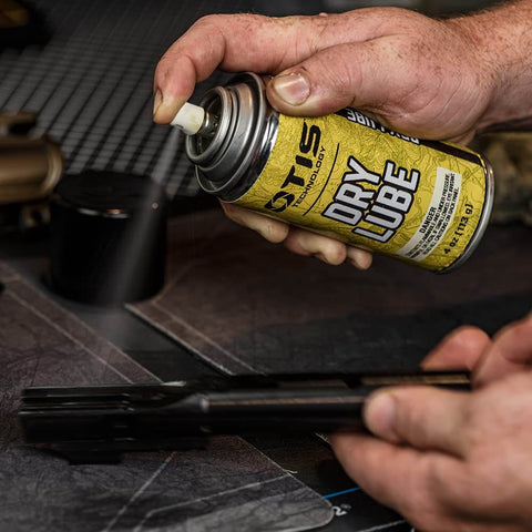 Dry Lube Aerosol 4 Oz Fast Acting Lubricant Spray For Metal Surfaces Dries In Seconds being used on metal tool